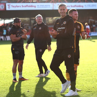 111025 - Accrington Stanley v Newport County - Sky Bet League 2 - Newport manager David Hughes looking pleased as he applauds the travelling fans