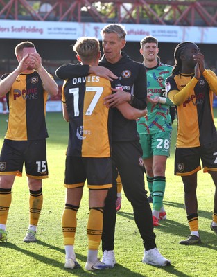 111025 - Accrington Stanley v Newport County - Sky Bet League 2 - Team and manager applaud the travelling fans Newport manager David Hughes hugs Tom Davies of Newport