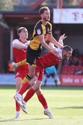 111025 - Accrington Stanley v Newport County - Sky Bet League 2 - Matt Baker of Newport climbs onto the back of Liam Coyle of Accrington with Josh Smith of Accrington