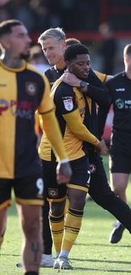 111025 - Accrington Stanley v Newport County - Sky Bet League 2 - Newport manager David Hughes hugs goalscorer Bobby Kamwa of Newport at the end of the match