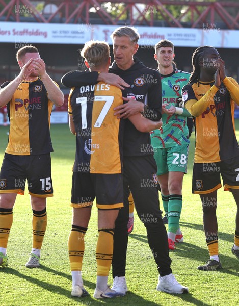 111025 - Accrington Stanley v Newport County - Sky Bet League 2 - Team and manager applaud the travelling fans Newport manager David Hughes hugs Tom Davies of Newport