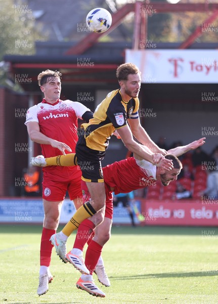 111025 - Accrington Stanley v Newport County - Sky Bet League 2 - Matt Baker of Newport climbs onto the back of Liam Coyle of Accrington with Josh Smith of Accrington