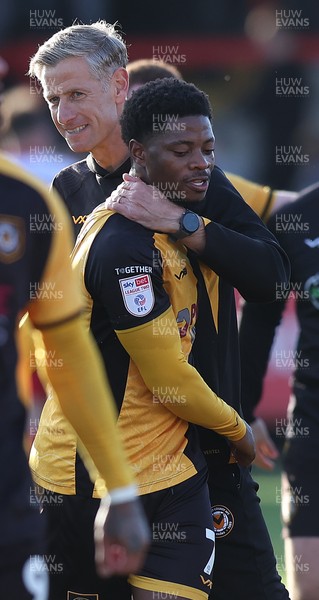 111025 - Accrington Stanley v Newport County - Sky Bet League 2 - Newport manager David Hughes hugs goalscorer Bobby Kamwa of Newport at the end of the match