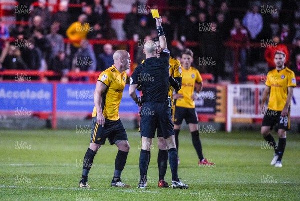 181117 - Accrington Stanley v Newport County - Sky Bet League 2 - Newport County defender Ben Tozer (12) is given a yellow card by referee Darren Drysdale