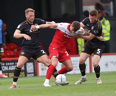 190926 - Accrington Stanley v Newport County - Sky Bet League 2 - Cameron Norman of Newport and Lee Jenkins of Newport contain Tyler Walton of Accrington