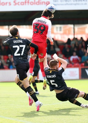 190926 - Accrington Stanley v Newport County - Sky Bet League 2 -Josh Woods of Accrington heads away from Lee Jenkins of Newport and Christian Doidge of Newport