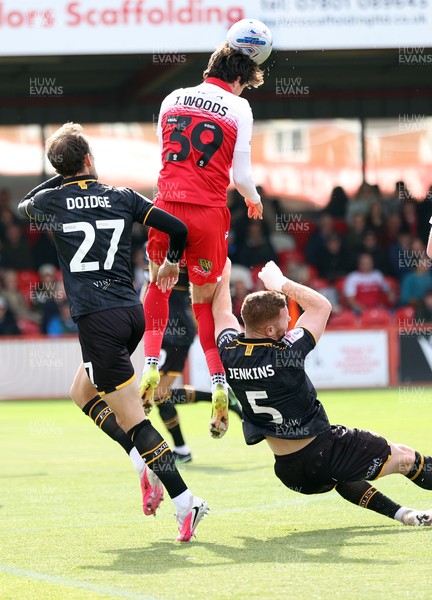 190926 - Accrington Stanley v Newport County - Sky Bet League 2 -Josh Woods of Accrington heads away from Lee Jenkins of Newport and Christian Doidge of Newport