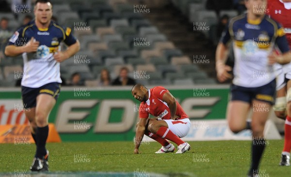 120612 - ACT Brumbies v Wales -Aled Brew of Wales feels an injury