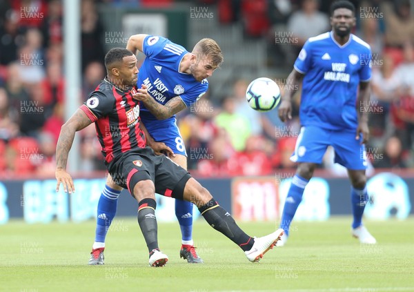 110818 - AFC Bournemouth v Cardiff City, Premier League - Joe Ralls of Cardiff City and Callum Wilson of Bournemouth compete for the ball