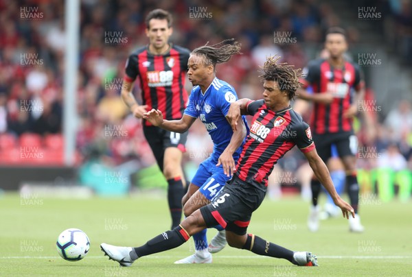 110818 - AFC Bournemouth v Cardiff City, Premier League - Bobby Reid of Cardiff City is challenged by Nathan Ake of Bournemouth