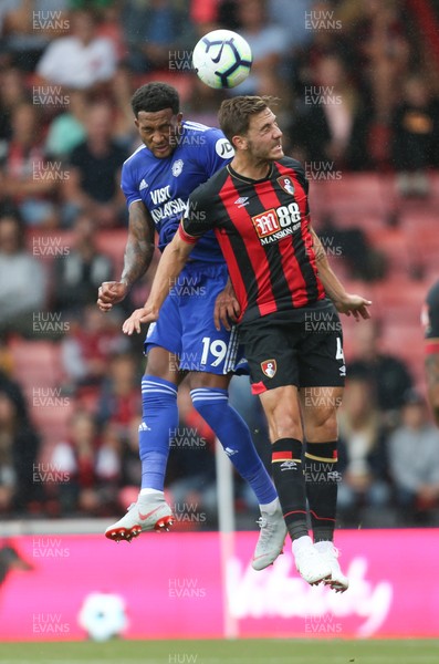 110818 - AFC Bournemouth v Cardiff City, Premier League - Nathaniel Mendez Laing of Cardiff City beats Dan Gosling of Bournemouth as he heads the ball at goal