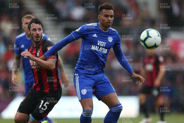 110818 - AFC Bournemouth v Cardiff City, Premier League - Josh Murphy of Cardiff City holds off the challenge from Adam Smith of Bournemouth