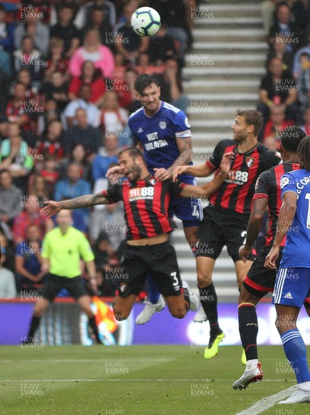 110818 - AFC Bournemouth v Cardiff City, Premier League - Sean Morrison of Cardiff City puts Steve Cook of Bournemouth under pressure as he wins the battle to head the ball at goal