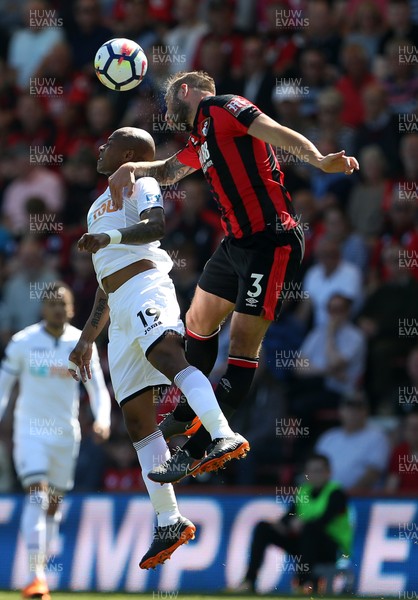 050518 - AFC Bournemouth v Swansea City - Premier League - Andre Ayew of Swansea and Steve Cook of Bournemouth go up for the ball