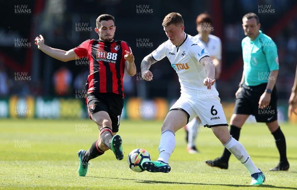 050518 - AFC Bournemouth v Swansea City - Premier League - Alfie Mawson of Swansea is tackled by Lewis Cook of Bournemouth