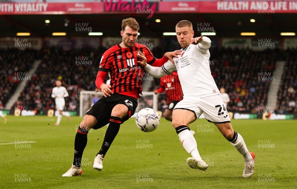 061121 - AFC Bournemouth v Swansea City, Sky Bet Championship - Jake Bidwell of Swansea City and Jack Stacey of Bournemouth compete for the ball