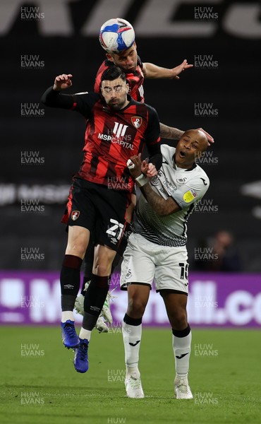 160321 - AFC Bournemouth v Swansea City - SkyBet Championship - Diego Rico goes up for the ball with Dominic Solanke of Bournemouth and Andre Ayew of Swansea City