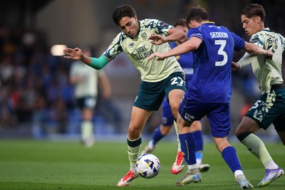190825 - AFC Wimbledon v Cardiff City - Sky Bet League 1 - Joel Colwill of Cardiff City is challenged by Steve Seddon of Wimbledon