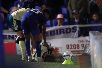 190825 - AFC Wimbledon v Cardiff City - Sky Bet League 1 - Ollie Tanner of Cardiff City is stretched off after picking up an injury