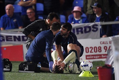 190825 - AFC Wimbledon v Cardiff City - Sky Bet League 1 - Ollie Tanner of Cardiff City is stretched off after picking up an injury