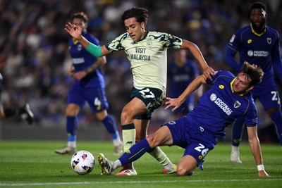190825 - AFC Wimbledon v Cardiff City - Sky Bet League 1 - Joel Colwill of Cardiff City is challenged by Riley Harbottle of Wimbledon