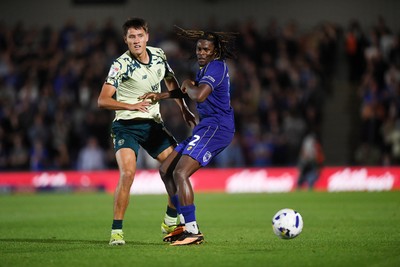 190825 - AFC Wimbledon v Cardiff City - Sky Bet League 1 - Rubin Colwill of Cardiff City is challenged by Nathan Asiimwe of Wimbledon