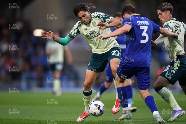 190825 - AFC Wimbledon v Cardiff City - Sky Bet League 1 - Joel Colwill of Cardiff City is challenged by Steve Seddon of Wimbledon