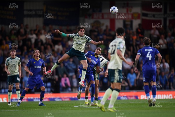 190825 - AFC Wimbledon v Cardiff City - Sky Bet League 1 - Joel Colwill of Cardiff City wins the header