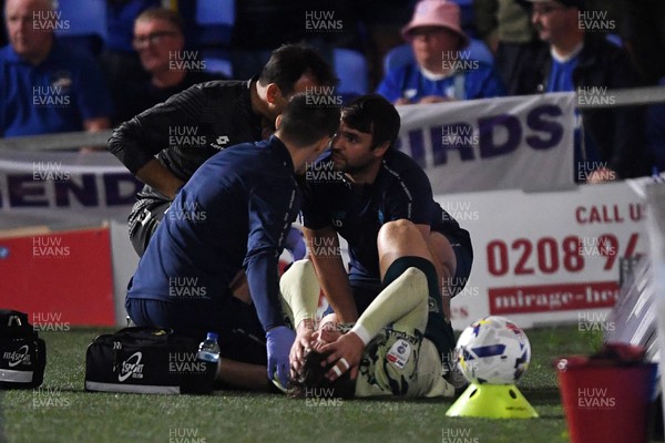 190825 - AFC Wimbledon v Cardiff City - Sky Bet League 1 - Ollie Tanner of Cardiff City is stretched off after picking up an injury