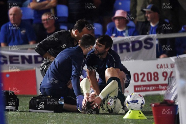 190825 - AFC Wimbledon v Cardiff City - Sky Bet League 1 - Ollie Tanner of Cardiff City is stretched off after picking up an injury