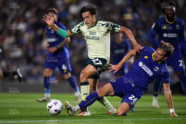 190825 - AFC Wimbledon v Cardiff City - Sky Bet League 1 - Joel Colwill of Cardiff City is challenged by Riley Harbottle of Wimbledon