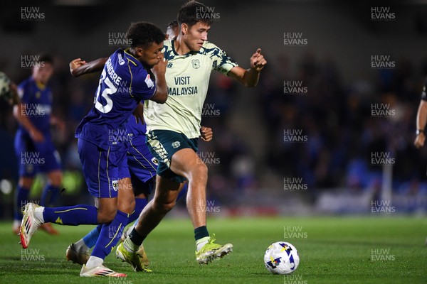 190825 - AFC Wimbledon v Cardiff City - Sky Bet League 1 - Rubin Colwill of Cardiff City is challenged by Leo Young of Wimbledon