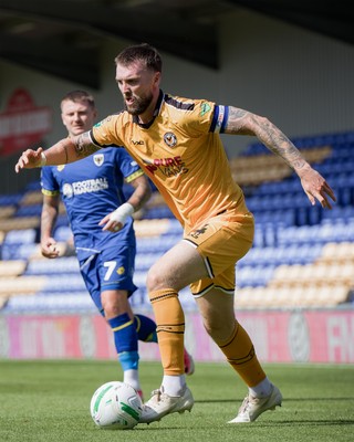 080826 - AFC Wimbledon v Newport County - Carabao Cup First Round - Kyle Cameron of Newport County in action