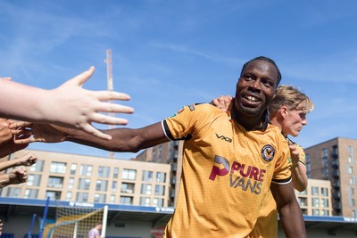 080826 - AFC Wimbledon v Newport County - Carabao Cup First Round - Yahya Bamba of Newport County celebrates his goal with fans