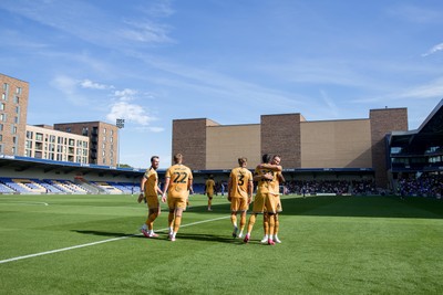 080826 - AFC Wimbledon v Newport County - Carabao Cup First Round - Yahya Bamba of Newport County celebrates his goal with teammates
