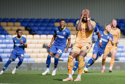 080826 - AFC Wimbledon v Newport County - Carabao Cup First Round - Shaquille Gwengwe of Newport County reacts after missing a penalty