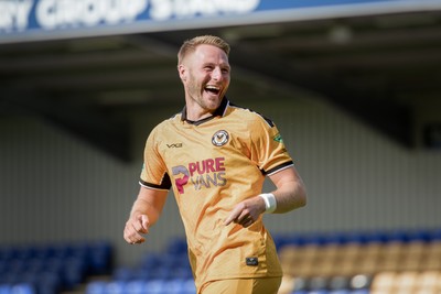 080826 - AFC Wimbledon v Newport County - Carabao Cup First Round - Cameron Norman of Newport County celebrates after scoring a penalty during the penalty shootout