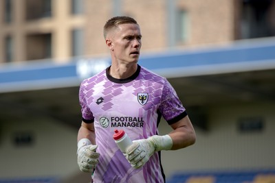 080826 - AFC Wimbledon v Newport County - Carabao Cup First Round - Nathan Bishop of AFC Wimbledon during the penalty shootout