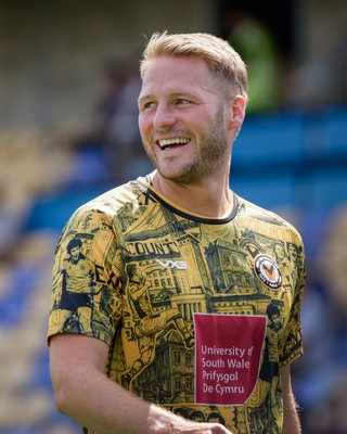 080826 - AFC Wimbledon v Newport County - Carabao Cup First Round - Cameron Norman of Newport County warming up