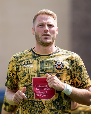 080826 - AFC Wimbledon v Newport County - Carabao Cup First Round - Cameron Norman of Newport County warming up