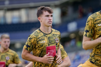 080826 - AFC Wimbledon v Newport County - Carabao Cup First Round - Harrison Pugh of Newport County warming up