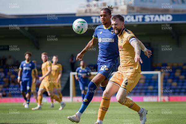 080826 - AFC Wimbledon v Newport County - Carabao Cup First Round - Alistair Smith of AFC Wimbledon and Kyle Cameron of Newport County in action
