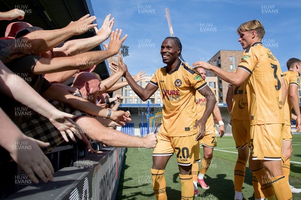 080826 - AFC Wimbledon v Newport County - Carabao Cup First Round - Yahya Bamba of Newport County celebrates his goal with fans