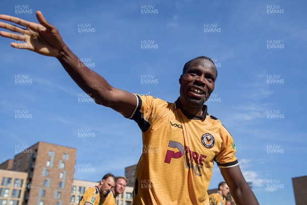 080826 - AFC Wimbledon v Newport County - Carabao Cup First Round - Yahya Bamba of Newport County celebrates his goal with fans