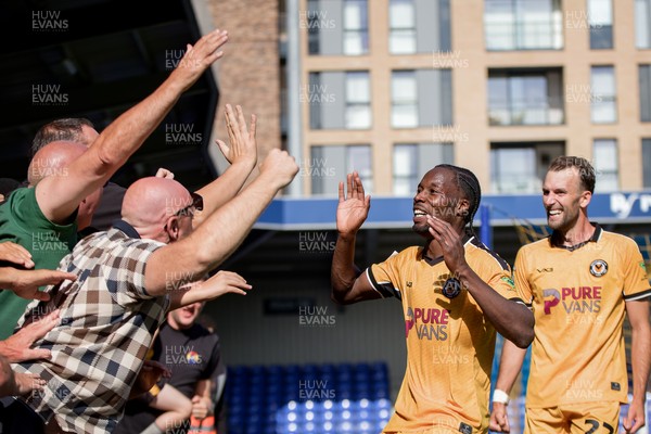080826 - AFC Wimbledon v Newport County - Carabao Cup First Round - Yahya Bamba of Newport County celebrates his goal with the fans