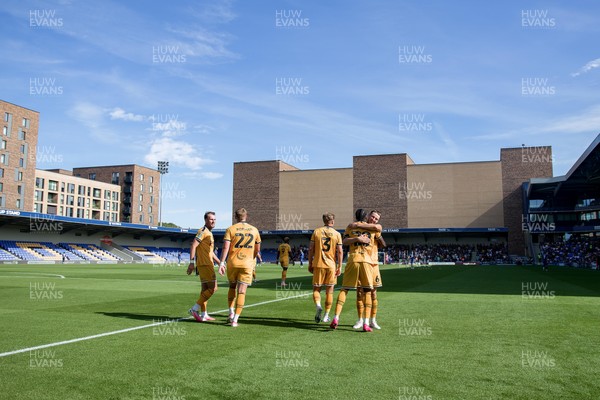 080826 - AFC Wimbledon v Newport County - Carabao Cup First Round - Yahya Bamba of Newport County celebrates his goal with teammates