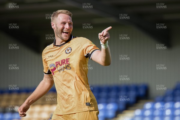 080826 - AFC Wimbledon v Newport County - Carabao Cup First Round - Cameron Norman of Newport County celebrates after scoring a penalty during the penalty shootout