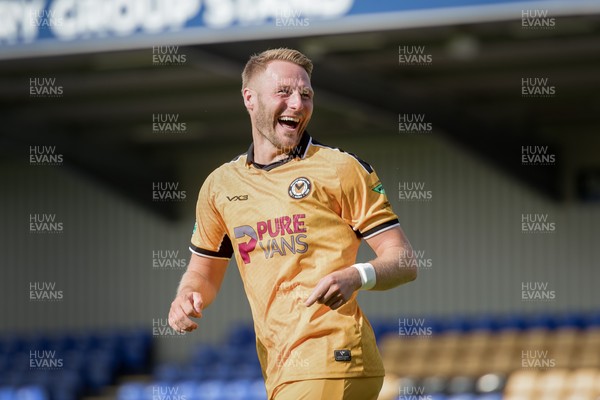080826 - AFC Wimbledon v Newport County - Carabao Cup First Round - Cameron Norman of Newport County celebrates after scoring a penalty during the penalty shootout