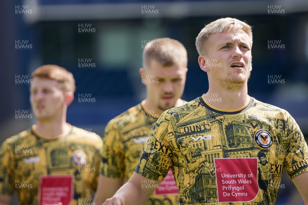 080826 - AFC Wimbledon v Newport County - Carabao Cup First Round - Matthew Smith of Newport County warming up