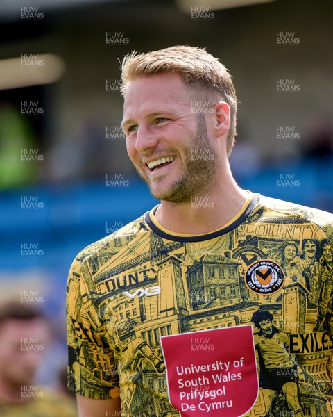 080826 - AFC Wimbledon v Newport County - Carabao Cup First Round - Cameron Norman of Newport County warming up